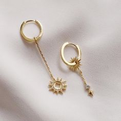 Sunlit Drop Gold Earrings – Wanderlust + Co Celestial Dangle Earrings For Everyday, Celestial Style Dangle Earrings For Everyday, Everyday Celestial Dangle Earrings, Celestial Drop Earrings For Everyday, Everyday Celestial Drop Earrings, Everyday Teardrop Earrings With Dangling Charms, Celestial Drop Earrings Tarnish Resistant, Single Long Drop Hoop Earring As A Gift, Celestial Dangle Huggie Earrings As Gift