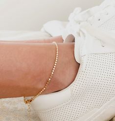 Dazzle and sparkle everywhere you go with this Gold Anklet. Show off your confidence and fashion-forward style with this shining gold ankle bracelet. Perfect for any occasion, this waterproof anklet is perfect for summer. Metal: 18k Gold FilledSize: 2mm wide, 9 inches long with 2 inches extender Hypoallergenic AnkletsWaterproof Anklets Gold Bracelet With Delicate Chain For Summer, Trendy Gold Anklet With Adjustable Chain, Gold Delicate Chain Bracelet For Summer, Delicate Gold Chain Bracelet For Summer, Gold Anklets For Everyday Summer Wear, Gold Bracelet For Summer, Adjustable Gold Trendy Anklets, Gold Adjustable Chain Anklet For Summer, Gold Bracelets For Summer