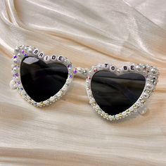 💖💖 Step into the enchanting world of our meticulously crafted heart-shaped sunglasses, where passion meets precision in every detail. Adorned with exquisite pearl embellishments, these sunglasses are a testament to artisanal artistry, perfect for your bridal ensemble. 💍💍 Elevate your bridal style effortlessly with these stunning sunglasses, designed to enhance your special moments. Whether it's your wedding day, honeymoon, bridal shower, or bachelorette party, let these shades add a touch of White Heart-shaped Sunglasses With Gradient Lenses, Heart-shaped Sunglasses For Summer Weddings, Heart-shaped Wedding Sunglasses For Summer, White Sunglasses With Gradient Lenses As Gift, White Sunglasses With Gradient Lenses As A Gift, White Sunglasses With Uv Protection As Gift, White Heart-shaped Sunglasses For Beach, Heart-shaped Glass Sunglasses For Gift, Heart-shaped Glass Sunglasses As Gift