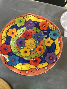 a colorful plate sitting on top of a table