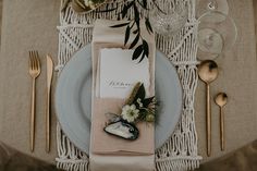 a table setting with place settings and silverware