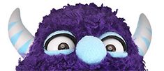 a close up of a purple stuffed animal with big eyes and large, long horns