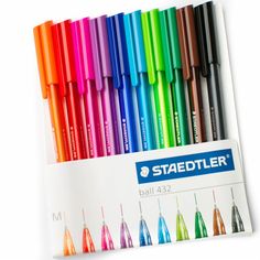 several different colored pens are lined up in a display box with the same color as each one