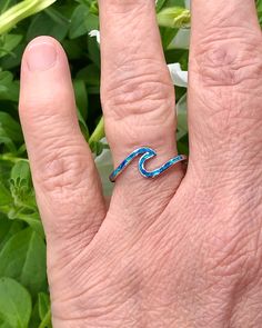 Sterling Silver Wave Ring with Blue Lab Opal | The Life Divine Keep the ocean close and go with the flow. This sterling silver Wave Ring symbolizes the ups and downs we see in life, reminding you to roll with the tides. Wear this ring as a reminder to stay positive, happy and strong regardless of what life throws your way.Cherished for its brilliance, Opal is known as a stone of creativity and vitality. Opal is also a reflective stone of protection, absorbing energies and sending them back to th Ocean-inspired Blue Ring For Gift, Ocean-inspired Blue Ring For Gifts, Ocean-inspired Blue Rings As Gifts, Wave Ring, Go With The Flow, Stay Positive, What Is Life About, The Ocean, Ring Designs