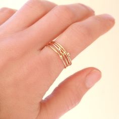 ONE dainty (1mm) solid 14k gold stacking band is adorned with a teensy 14k gold droplet. Small and dainty, stack several as a set or wear with some of the other stacking rings in our collection for variety. We think you could love these, too: ►Sterling SILVER tiny droplet ring: http://etsy.me/1x03Qe2 ►Gold GEMSTONE stacking ring: http://etsy.me/1zpjYI0 ►Gold INITIAL ring: http://etsy.me/1gamTHo ** Enjoy browsing our shop: http://etsy.me/1mC0gmu ** {YOU CAN SAVE!} Think bridesmaids, gifts, keep o Dainty Stackable Promise Rings, Simple 14k Gold Midi Rings, Dainty Stackable Adjustable Rings With Simple Design, Simple 14k Gold-filled Yellow Stackable Rings, Simple 14k Gold Filled Yellow Stackable Rings, Dainty Stackable Rings With Simple Design, Adjustable Dainty Stackable Rings, Simple Tiny Yellow Gold Stackable Rings, Minimalist 14k Gold Filled Stackable Rings For Anniversary