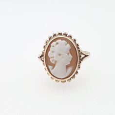 "An vintage cameo ring in solid 9ct 375 yellow gold with a decorative border.  The cameo is hand carved from genuine shell and is in good condition. The inner shank is hallmarked \"V\" for 1995. It weighs approx. 2.8 g. and sizes at approx. UK N or US 6.75. Please check out the other items in my shop. Be sure to view all photos and videos for condition and read the titles and descriptions. Sizes are in the latter photos.  Don't hesitate to send me a message with any queries. All my items are use Gold Cameo Signet Ring Collectible, Gold Signet Ring With Cameo Collectible, Victorian Gold Cameo Rings, Gold Cameo Rings For Anniversary, Classic Gold Cameo Signet Ring, Classic Gold Signet Ring With Cameo, Gold Cameo Rings For Formal Occasions, Gold Cameo Signet Ring 14k, Gold Round Cameo Signet Ring