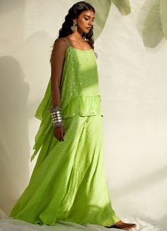 Channel your inner boho queen in this Lime Green Spaghetti double-layered short Bandhej kurta with mirror detailing teamed with matching Bandhej Sharara pants. Dupatta can be added at an additional cost Composition : Silk Care: Dry Clean Only and Vacuum Storage This product can be customised for sleeves, length of blouse and neckline Delivery : 4-6 weeks as the product is hand crafted. For more information and sizes please contact fabiliciousfashion@gmail.com or visit our Copenhagen studio.About Bandhani Sharara, Green Spaghetti, Boho Queen, Sharara Pants, Layered Short, Vacuum Storage, Indian Wedding Wear, Sharara Set, Wedding Wear