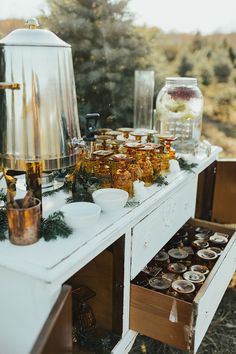 an outdoor buffet table is set up with food and drinks