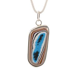 Handmade Fordite necklace Stunning Fordite piece set in sterling silver, open back step bezel. Fordite dates back to the 1920's when layers upon layers of paint would build up in the bays, eventually needing to be removed. Someone discovered that the dried up paint layers could be cut and polished just like gemstones, resulting in unique colors and patterns, creating stunning one-of-a-kind pieces. Most of the Fordite used today is from the 60's to late 70's since the 1980's is when car manufactu Unique Sterling Silver Necklace With Rectangular Pendant, Artistic Sterling Silver Necklace, Artistic Sterling Silver Necklace With Oval Pendant, Artistic Oval Sterling Silver Necklace, Artistic Oval Sterling Silver Necklaces, Sterling Silver Gemstone Necklace For Collectors, Sterling Silver Gemstone Necklace, Back Steps, Car Manufacturers