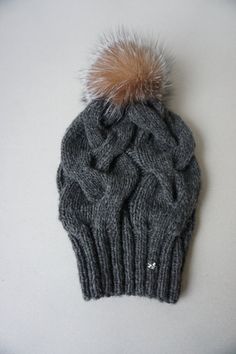 "Chunky knit, slouchy hat in a textured cable pattern. The hat is knit from very soft yak and merino blend to keep you warm in the cold weather. The natural Fox fur pompon is attached with a press - stud button and should be taken off before washing. In the front of the hat in the left side is sewing on Swarovski crystal One size, which fits heads from - M 20,5-22,4 inches (53-57cm) - L 21,5-23,2 inches (53-59cm) the pom pom size about 12-13cm /4,7-5\" Fiber Content: 50 % Yak 40 % Merino wool 10 Cozy Cable Knit Hats, Cable Knit Beanie For Cold Weather, One Size Cable Knit Cap, One Size Cable Knit Beanie, One-size Cable Knit Beanie, One Size Cable Knit Crochet Hat, One-size Cable Knit Crochet Hat, Cable Knit Cap One Size Fits Most, Cable Knit Beanie Cap