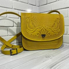 » A-Store « » Seller Profile « » Feedback profile « » Send us a message « Women's Yellow HANDMADE embossed LEATHER bag lady's Handbag KAMEIA The best handmade leather goods of various shades and textures first hand from the manufacturer. Here are the original products made of genuine leather. There are many models, among which it is easy to choose the right one. ATTENTION!!! Color tones may differ from the photo on the screen of devices depending on the type of screen and color reproduction. In Luxury Embossed Shoulder Bag, Luxury Leather Embossed Shoulder Bag, Luxury Leather Shoulder Bag With Embossed Detail, Luxury Embossed Leather Shoulder Bag, Embossed Top Handle Bag For Travel, Embossed Top Handle Travel Bag, Luxury Embossed Leather Satchel, Hand Tooled Crossbody Satchel For Travel, Hand Tooled Crossbody Travel Bag