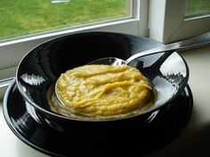 a bowl filled with food sitting on top of a window sill