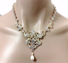 "An old hollywood glamour wedding style gold plated bridal necklace featuring Art Deco, Art Nouveau and Victorian details. This statement wedding jewelry is made of clear swarovski crystals and pearl teardrop dangle option, set on 18k gold plated base and chain. Necklace choker total length is about 16\" (40.5cm) long. Crystals part is 13\" (33cm) and chain 3\" (7.5cm) long. View all necklaces at https://etsy.me/1jokpF5" Vintage Bridal Necklace With Intricate Design For Wedding, Antique Silver Bridal Necklace For Wedding, Vintage Wedding Necklaces With Intricate Design, Ornate Filigree Necklaces For Weddings, Ornate Bridal Necklace With Intricate Design For Wedding, Antique Bridal Necklace With Intricate Design, Art Deco Filigree Necklaces For Wedding, Antique Bridal Necklace With Intricate Design For Wedding, Vintage Filigree Wedding Necklace