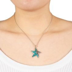 This turquoise filigree starfish pendant necklace offers beautiful seaside style. FEATURES Pendant size: 1.3"L x 1.0"W Chain length: 16 in. + 2-in. extender Chain type: rope Clasp: lobster-claw Metal: sterling silver Plating: sterling silver Finish: oxidized, polished Nickel freeSTONE DETAILS Stone type: turquoise Center stone size: 12 mm Shape: free form Setting: inlay Size: 16". Color: White. Gender: female. Age Group: adult. Turquoise Starfish Ocean-inspired Jewelry, Bohemian Turquoise Starfish Jewelry, Bohemian Starfish-shaped Turquoise Jewelry, Turquoise Ocean-inspired Jewelry With Starfish Charm, Turquoise Necklace With Starfish Charm, Turquoise Necklaces With Starfish Charm For Beach, Turquoise Necklace With Starfish Charm For Beach, Turquoise Ocean-inspired Necklace With Starfish Charm, Beach Turquoise Necklace With Starfish Charm