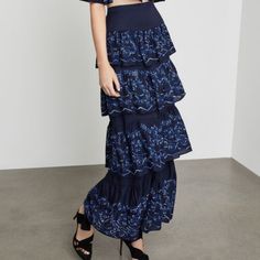 Crafted From Multiple Tiers Of Floaty Botanical Eyelet, This Maxi Skirt Sits At Your Natural Waist And Gently Grazes The Tops Of Your Feet. Concealed Center Back Zipper And Hook-And-Eye Closures Fabric Self: 100% Rayon Eyelet Machine Wash Imported Evening Tiered Ruffle Maxi Skirt, Evening Tiered Maxi Skirt With Ruffles, Evening Maxi Tiered Skirt With Ruffles, Spring Evening Ruffled Maxi Skirt, Elegant Tiered Maxi Skirt, Bohemian Ruffled Maxi Skirt For Party, Elegant Tiered Bottoms For Summer, Evening Tiered Maxi Skirt For Spring, Summer Evening Ruffled Maxi Skirt