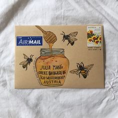 a piece of paper with an image of a jar of honey and bees on it