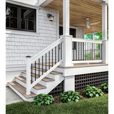 a white house with a porch and stairs