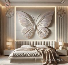 a bedroom with a large white butterfly on the wall above the headboard and bed