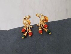 sizes in terms of height and weight are mentioned in grams and inches in the photo Gold Stone Earrings, Stones Earrings, Small Studs Earrings, Elegant 22k Gold Gemstone Earrings, Gold Plated Gemstone Temple Jewelry Earrings, Gold Gemstone Jewelry For Puja, Earrings Design, Ear Rings, Festive 22k Gold Gemstone Earrings