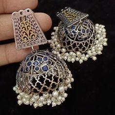 German Silver Oxidized TwoTone Big Jhumka/Afghani Silver Jhumka/Dual Tone/Blue/Green Oxidized Jhumka/Dual Tone Jhumka Earring @JhumkaStop - Contemporary earrings with simulated stones in silver golden dual tone finish. - Very Elegant and stylish, these earrings can be paired with any traditional Indian or Western Attire depending upon the occasion and the theme. - The base is pure brass (90%) and pure 92.5 silver (10%) which makes this very sturdy and of good quality. - 100% guarantee on the pol Fusion Style Jhumkas With Latkans For Celebration, Fusion Style Jhumkas For Diwali Celebration, Fusion Style Jhumkas For Navratri Celebration, Multicolor Chandbali Jhumkas With Intricate Design, Blue Jhumkas With Latkans For Celebration, Blue Latkans Jhumkas For Celebration, Blue Temple Jewelry Jhumkas For Celebration, Blue Cutdana Jhumkas For Wedding, Temple Style Blue Jhumkas For Celebration