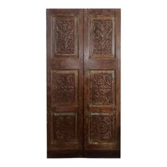 an old wooden door with carvings on it