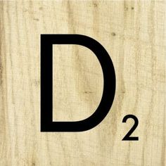 a wooden sign with the letter d on it