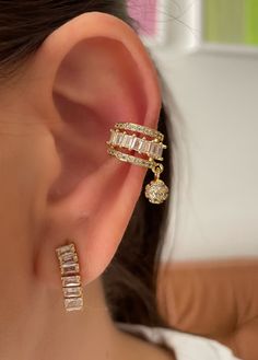 Indulge in luxury with our Kate Earrings. These exquisite baguette zirconia pieces are delicately handcrafted and plated in gold for a touch of elegance. The unique earcuff design adds a modern twist, while the dangle bead adds a subtle touch of movement. Elevate your style and make a statement with these exclusive earrings. Exclusive Earrings, Wrist Stack, Gold Chain Necklace, Beaded Dangles, Shine Bright, Earings Piercings, Gold Chain, Gold Chains, Piercings