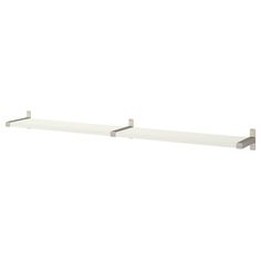 two white shelves with metal brackets on them