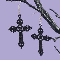 A pair of statement dangle earrings, large black gothic cross charms on 925 sterling silver ear wires.  MEASUREMENTS The cross charm measures 5.7cm x 3.7 cm MATERIALS These earrings are made with 925 sterling silver ear wires, which are hypoallergenic SHIPPING These earrings are made to order and will be sent with 1st class postage. -------------------- A matching velvet choker is also available:  https://www.etsy.com/uk/listing/1115524210/gothic-cross-velvet-choker-various?click_key=dc02222e5f89f5845d6c1f5408a2b634dc2dc9c5%3A1115524210&click_sum=25c7c0d8&ref=shop_home_feat_2 -------------------- Feel free to message me if you have any further questions! Don't forget to follow my Instagram @badghoulsclubuk to stay updated on new products and sales 🖤 Thanks for visiting! Goth Jewellery, Fashion Goth, Cross Choker, Gothic Cross, Gothic Crosses, Goth Jewelry, Metal Cross, Velvet Choker, Dark Gothic