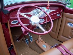 the interior of an old car with leather trim