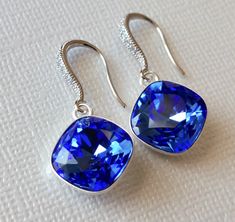 Sapphire Blue Royal Blue Color Cushion Cut Crystal Silver Dangle Wedding Earrings. PLEASE READ ITEM DESCRIPTION and SHOP POLICIES before placing your order, and contact me with any questions! EARRINGS are 1.18 inch (3cm) long from top of earring wire to bottom. BRIDAL EARRINGS SECTION: https://www.etsy.com/shop/LanaChayka?ref=seller-platform-mcnav§ion_id=11638940 BRIDAL JEWELRY SETS SECTION: https://www.etsy.com/shop/LanaChayka?ref=seller-platform-mcnav§ion_id=25839214 BRIDAL NECKLACES SECTION: Blue Dangle Bridal Earrings For Formal Occasions, Formal Blue Dangle Bridal Earrings, Blue Crystal Drop Earrings For Formal Occasions, Blue Dangle Crystal Earrings For Formal Occasions, Blue Round Bridal Earrings For Formal Occasions, Blue Bridal Earrings For Formal Occasions, Blue Dangle Bridal Earrings Gift, Nickel-free Blue Crystal Earrings For Formal Occasions, Blue Earrings With Ear Wire For Anniversary