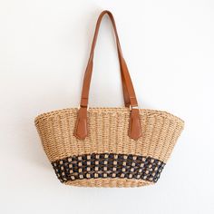 IN STOCK FAST SHIPPING FROM LOS ANGELES Take on the summer with our handmade straw bag! With a large opening and inner pocket, this beach bag is perfect for all your sunny essentials. Simple, durable, and oh-so-cool, this basket bag is the ultimate summer companion. Get ready to turn heads with this unique, stylish statement piece! Plus, it's made with love and care for a unique and stylish statement that's sure to turn heads. Who says functional can't be fun? Get your beach fashion game on point with this versatile and playful bag! High Quality Synthetic Leather Strap Inner Lining with Zipper Closure Size: 7"H x 15"W x 6.5"D Strap drop length: 11" Designer Style ID: 8637 Beachy Beach Bag With Braided Handles For Everyday Use, Everyday Beachy Beach Bag With Braided Handles, Everyday Straw Beach Bag, Beachy Jute Straw Bag For Daily Use, Beachy Straw Bag For Everyday Use, Beachy Brown Straw Bag For Everyday Use, Beachy Jute Straw Bag, Daily Use Beachy Jute Straw Bag, Vacation Basket Shoulder Bag