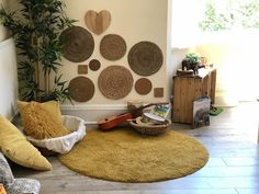 a living room filled with lots of furniture and decor on the wall above it is a yellow area rug