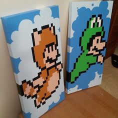 two video game canvases sitting on top of a wooden floor next to each other