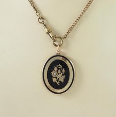 A charming antique Victorian oval 14k gold and enamel mourning pendant. The front is finely hand chased in gold to the  black enamel with a rose of Sharon with two buds and foliage, from the language of flowers, the rose of Sharon with a seed pearl center, 2mm in diameter. With a delicate band of chasing and a further black enamel band. The reverse with a 14k gold panel. The pendant is filled with resin to give stability. Unmarked, the complete pendant acid tests as 14k gold. The chain is for di Rose Of Sharon, Language Of Flowers, Seed Pearl, Black Enamel, Jewelry Necklace Pendant, Jewelry Necklaces, Gift Card, Pendant Necklace, Band