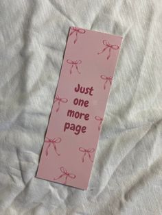 a pink bookmark that says just one more page