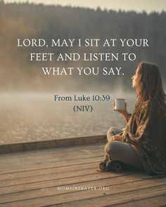 a woman sitting on a dock holding a cup with the words, lord may sit at your feet and listen to what you say