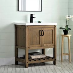 a bathroom vanity with a sink and mirror