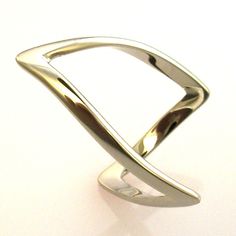 Gracefully elegant, unique and simple...The perfect equation for a timeless design that has been a best seller for me for over thirty years! Metal: SOLID STERLING SILVER Ring Size: Size Selectable! I can make this ring in sizes up to 8.5 (beyond that the ring shape changes too much). Please see my ring sizing policy on my Polices page: http://www.etsy.com/shop/dougpetersonjewelers/policy Shipment Timeline: Because I custom make all of my items to order, most items are shipped out within 7 busine Contemporary Open Band Rings For Formal Occasions, Modern Hallmarked Stackable Rings For Formal Occasions, Modern Hallmarked Stackable Rings For Formal Events, Modern Adjustable Stackable Rings With Open Band, Modern Adjustable Stackable Rings For Anniversary, Modern Polished Jewelry For Promise Ring, Modern Jewelry With Polished Finish For Promise Ring, Modern Hallmarked Open Ring Jewelry, Modern Hallmarked Open Band Jewelry