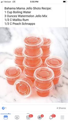 a bunch of plastic cups sitting on top of a marble counter next to each other