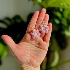 Charming Pink Daisy Micro Crochet Dangle Earrings--A delicate floral touch to elevate your style. Handcrafted with precision using quality cotton thread, these earrings are not only lightweight but also hypoallergenic, ensuring comfort for sensitive ears. The intricate micro crochet technique showcases a soft, delicate pink design, adding a touch of nature-inspired elegance to any outfit. Treat yourself or a loved one to these unique, artisanal earrings that effortlessly blend beauty and craftmanship.   These flowers are approximately 2.5cm in size. They have been crocheted by me with a 1.5mm hook and cotton thread, then finished with hypoallergenic silver-plated copper sterling ear wires. Handmade Dainty Flower Earrings, Handmade Small Adjustable Earrings, Handmade Adjustable Small Earrings, Handmade Pink Everyday Jewelry, Handmade Delicate Hoop Earrings As Gift, Handmade Dainty Jewelry, Handmade Pink Jewelry For Everyday Wear, Handmade Flower Earrings For Crafting, Delicate Handmade Everyday Earrings