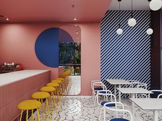 an empty restaurant with yellow stools and blue circles painted on the wall behind it