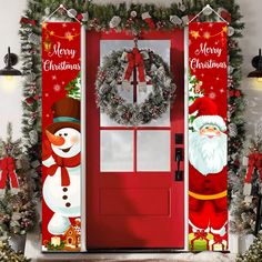 a red door decorated with christmas decorations and wreaths