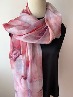 Large long natural mulberry silk chiffon scarf with dimension of 180cm x 110 cm/ 71in x 43in. A watercolor styled print, with a soft blend of pinks and reds. The gorgeous flowers and the flowy petals bring a delightful feel of gentleness, and the dark red border ties the print together. Light weight, soft and sheer fabric, airy, breathable, and skin-friendly feels very comfortable to wear.  It's a beautiful addition to your outfit and can style it in different ways: drape it over shoulder and tie it as a shawl, wear the scarf as a soft neck scarf, as an evening cover up, as a head scarf, as an outdoor cover up or style it any way you want with your own sense of creativity... Suitable for all seasons and is a wonderful  gift idea for special occasions. Care Instructions: Pure silk is a type Purple Floral Wedding, Silk Neck Scarf, Silk Chiffon Scarves, Chiffon Shawl, Chiffon Wrap, Red Border, Outdoor Cover, Wedding Shawl, Scarf Silk