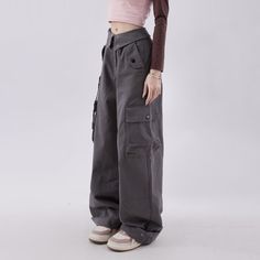 Introducing the Mystic Gray Gothic Cargo Pants - the perfect blend of comfort and style. These versatile pants feature a relaxed wide leg design, multiple pockets, and a fold over waistband style. Crafted from soft and durable broadcloth material, they are suitable for any occasion. Upgrade your wardrobe with these trendy and chic pants that embody both comfort and style. Relaxed wide leg design Multiple pockets Fold over waistband style Crafted from soft and durable broadcloth material Full Length Cotton Cargo Jeans With Elastic Waistband, Versatile High-waisted Cargo Wide Leg Pants, Baggy Parachute Pants For Fall, Baggy Full-length Parachute Pants For Fall, Fall Baggy Full-length Parachute Pants, Loosely Fitted Cotton Cargo Pants, Casual Full Length Wide Leg Pants With Belt Loops, Solid Wide Leg Cargo Pants With Belt Loops, Wide Leg Cotton Pants With Belt Loops