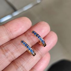 This stunning Earrings is set in 14k Solid Yellow Gold with Natural Blue Sapphire with utmost precision. It is a unique gemstone Drill Earrings for nearly every occasion and is completely hassle-free jewelry. ITEM DETAILS: *  GEM: Blue Sapphire * GEM SIZE: 2mm * GEM SHAPE: Round * Gem weight: 1.62 carats * Gold Purity: 14KT (58.33% approx.) * Gold Weight: 2.15 gram * Total Weight of the Earrings: 2.48 gram The Gold purity is guaranteed and it comes with authentic 14KT gold hallmark. Since my ite Blue Hoop Earrings With Prong Setting For Anniversary, Blue Round Hoop Earrings For Anniversary, Blue Hoop Earrings With Prong Setting, Blue Fine Jewelry Huggie Earrings For Gift, Blue Fine Jewelry Huggie Earrings As Gift, Blue Huggie Earrings Fine Jewelry Gift, Blue Hoop Huggie Earrings Gift, Blue Huggie Single Earring, Blue Huggie Hoop Earrings For Gift