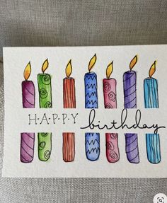 a birthday card with colorful candles on it