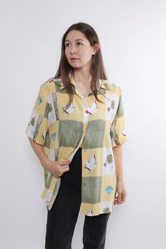 Hi! This is vintage yellow color short sleeves blouse with buttons closure and flowers pattern. This button front shirt made of  VISCOSE. The model in the photo is 170 cm tall and is wearing a LARGE size blouse.   D/NL 44; F/B 46; GB 18 - sizes on the tag. But, be careful, this is a vintage size, it is better to check the measurements below in the product description. Sleeve - 14cm / 5.51inch;  Width - 60cm / 23.62inch;  Length - 72cm / 28.34inch. All measurements are taken seam to seam while ly Retro Short Sleeve Blouse, Yellow Tops With Vintage Print For Summer, Yellow Printed Short Sleeve Hawaiian Shirt, Yellow Button-up Hawaiian Shirt For Spring, Yellow Spring Button-up Hawaiian Shirt, Yellow Collared Short Sleeve Shirt For Spring, Vintage Print Short Sleeve Hawaiian Shirt For Spring, Spring Vintage Print Hawaiian Shirt With Short Sleeves, Yellow Collared Hawaiian Shirt For Spring