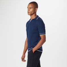 Crafted in a durable blend of cotton and polyester, this rib-stitch short-sleeved polo sweater showcases a solid flat knit Johnny collar, armbands, and waist. Soft against the skin with comfort stretch and added strength for lasting wear, it strikes the perfect balance between comfort and durability. Modern Short Sleeve Cotton Polo Sweater, Modern Cotton Short Sleeve Polo Sweater, Ribbed Cotton Collared Polo Shirt, Fitted Golf Tops With Ribbed Collar, Fitted Tops With Ribbed Collar For Golf, Fitted Navy Polo Sweater With Ribbed Collar, Navy Short Sleeve Polo Sweater With Ribbed Collar, Fitted Polo Shirt With Ribbed Collar For Golf, Relaxed Fit Short Sleeve Polo Sweater With Ribbed Collar