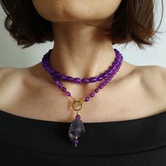 < Long glass beaded necklace with amethyst stone pendant > Very original and elegant combination. The stone is natural amethyst. Amethyst is the stone of St. Valentine and faithful love. It carries the energy of fire and passion, creativity and spirituality. This necklace can be beautiful accent to any look! > Necklace length - 89 cm (35 in) > Necklace weigth - 78 gm Purple Polished Beads Crystal Necklace As Gift, Elegant Amethyst Beaded Necklaces For Healing, Elegant Amethyst Beaded Necklace For Healing, Purple Amethyst Faceted Bead Crystal Necklaces, Handmade Purple Agate Beaded Necklaces, Lavender Amethyst Beaded Necklaces With Natural Stones, Purple Amethyst Gemstone Beaded Necklaces, Purple Amethyst Crystal Necklaces With Faceted Beads, Purple Amethyst Pendant Beaded Necklace